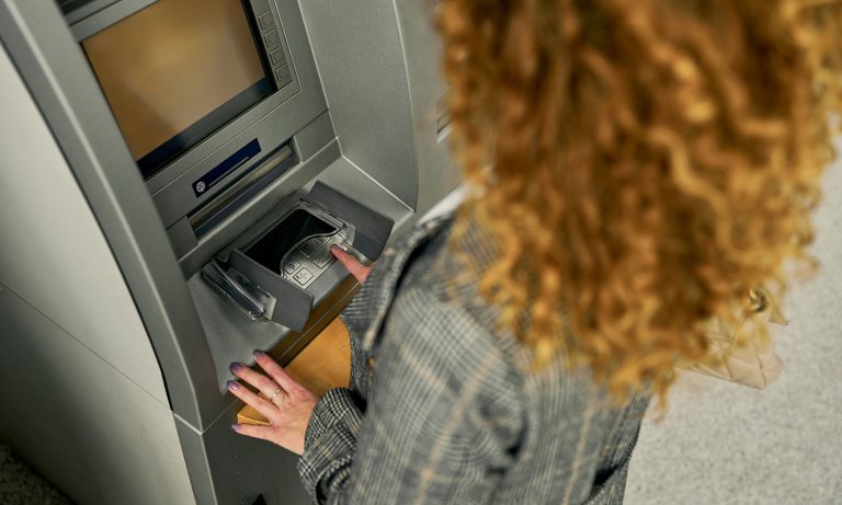 She received a call from the bank. After hearing what she heard, she ran to the ATM