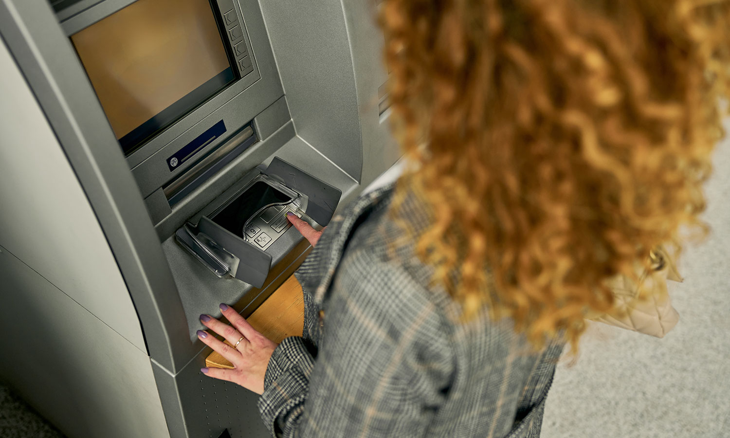 She received a call from the bank. After hearing what she heard, she ran to the ATM