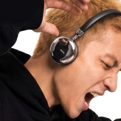 Headphones with a screen will display song lyrics to passers-by. But why?